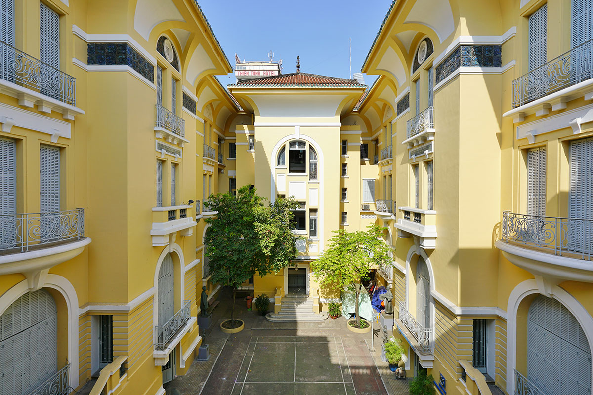 Interior of Fine Arts Museum in Ho Chi Minh City with visitors exploring exhibits 